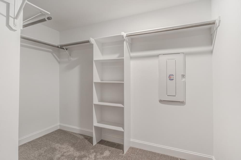 Master bedroom wood shelving and sweater tower option. 4br New Home in Wilmington, NC