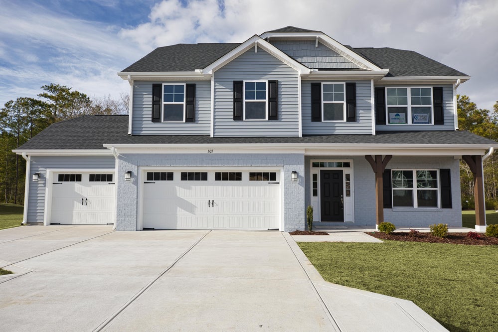 Elevation B with 3-Car Garage Option and Painted Brick. Drayton New Home in Jacksonville, NC